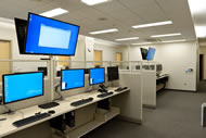 Physicians and clinic staff can call up lab results on computer terminals or access supplies in this private “backstage” area.